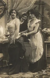 Man watching a woman dress